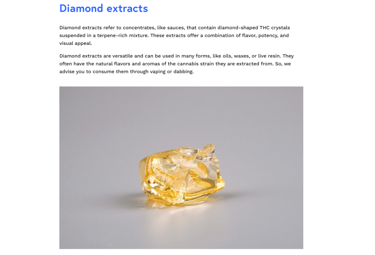 Diamond Extracts | Kurvana | Curated for years. Experienced in moments. Diamond-shaped THC concentrate crystal on a gray surface, showcasing its golden color and clarity for vaping or dabbing.