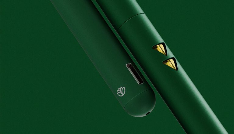 ascnd-rechargeable-aio-banner | Kurvana | Curated for years. Experienced in moments. Sleek green electronic device with yellow accents and USB port, set against a matching green background.